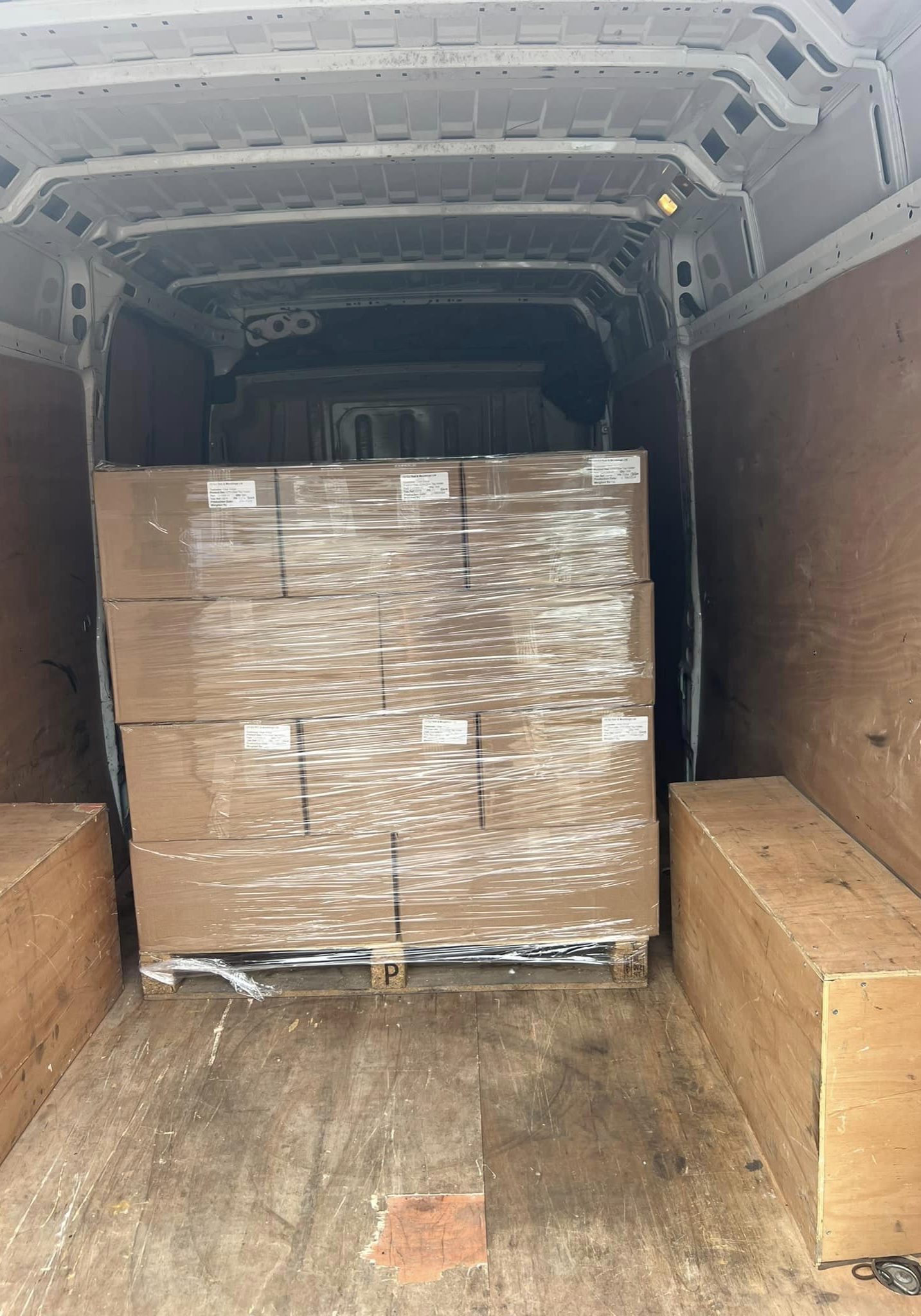 Securely packed pallet inside a delivery van, ready for transport by Kidderminster Logistics Ltd